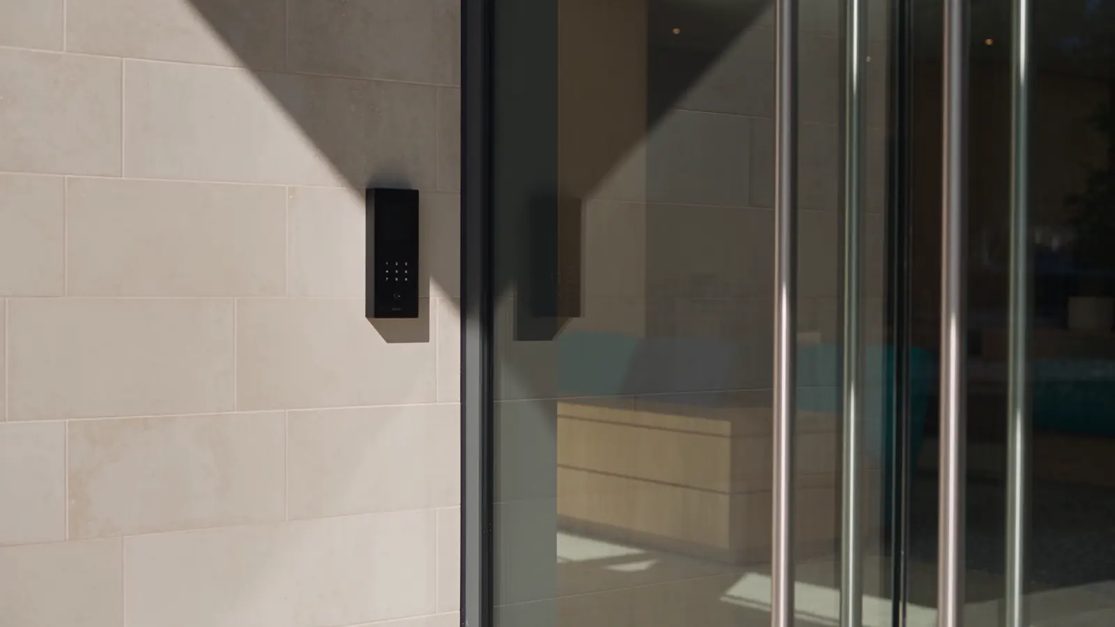 Concept illustration of a video intercom beside a visitor entrance.